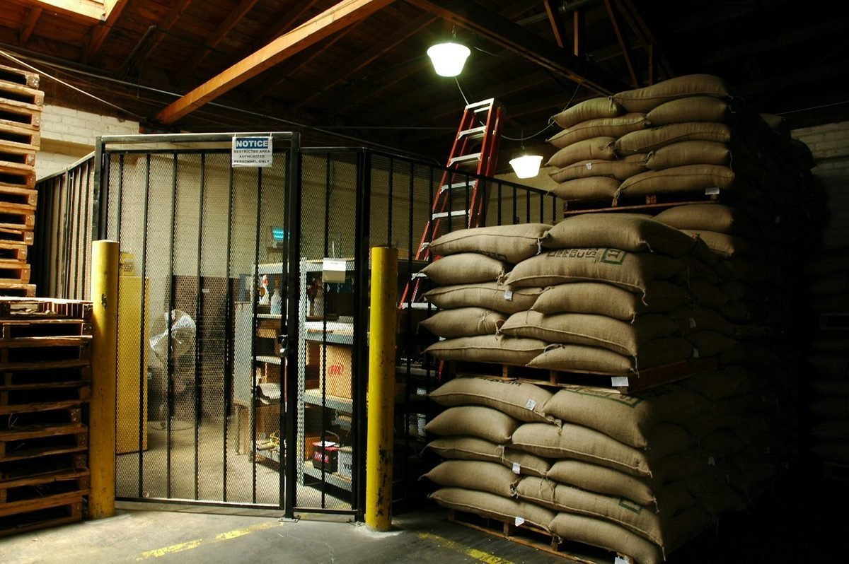 Stacked jute sacks in a coffee warehouse